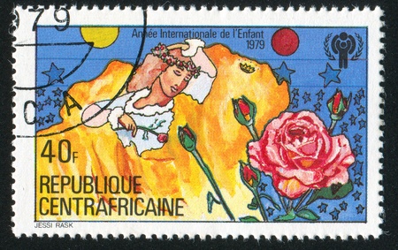 CENTRAL AFRICAN REPUBLIC 1979: stamp printed by Central African Republic, shows Girl and Rose, circa 1979の写真素材