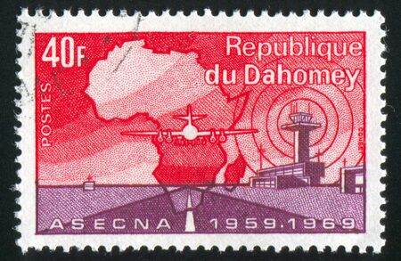 DAHOMEY - CIRCA 1969: stamp printed by Dahomey, shows Map of Africa, Plane, circa 1969の写真素材