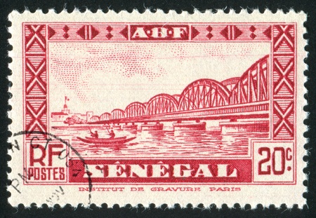 SENEGAL - CIRCA 1931: stamp printed by Senegal, shows Faidherbe Bridge, circa 1931.の写真素材
