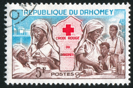 DAHOMEY CIRCA 1962: stamp printed by Dahomey, shows Red Cross Nurses, and Map, circa 1962のeditorial素材