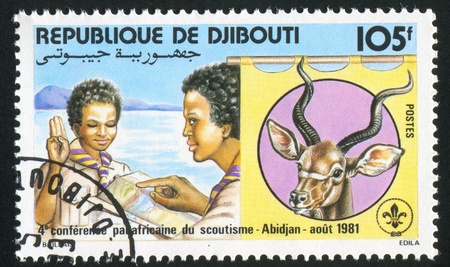 DJIBOUTI CIRCA 1981: stamp printed by Djibouti, shows Scout giving sign, circa 1981の写真素材