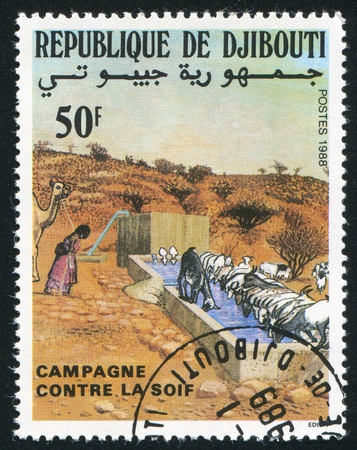 DJIBOUTI CIRCA 1988: stamp printed by Djibouti, shows Campaign Against Thirst, circa 1988の写真素材