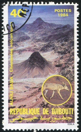 DJIBOUTI CIRCA 1984: stamp printed by Djibouti, shows Alaila Dada, jackal, circa 1984の写真素材