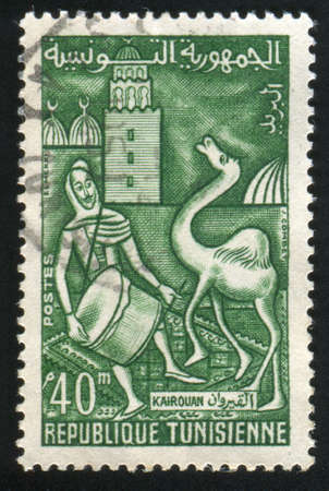 TUNISIA - CIRCA 1960: stamp printed by Tunisia, shows Festival at Kairouan, drummer and camel, circa 1960の写真素材