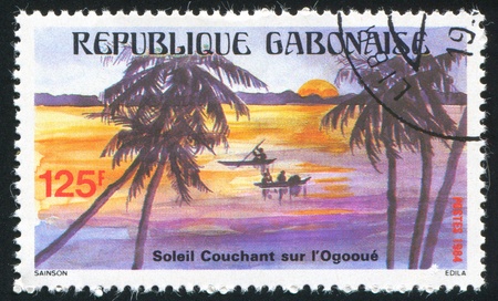 GABON CIRCA 1984: stamp printed by Gabon, shows Canoes, Ogooue River, circa 1984の写真素材