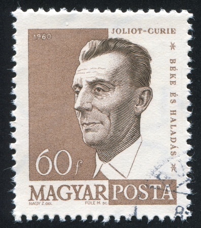 HUNGARY - CIRCA 1960: stamp printed by Hungary, shows Frederic Joliot-Curie, circa 1960のeditorial素材
