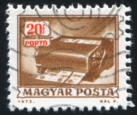 HUNGARY - CIRCA 1973: stamp printed by Hungary, shows money order canceling machine, circa 1973の写真素材