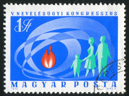HUNGARY - CIRCA 1970: stamp printed by Hungary, shows Flame and Family, circa 1970の写真素材