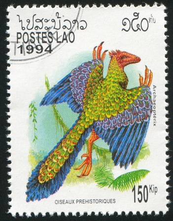 LAOS CIRCA 1994: stamp printed by Laos, shows Prehistoric Bird, circa 1994の写真素材