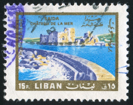 LEBANON CIRCA 1966: stamp printed by Lebanon, shows Castle of the Sea, Saida, circa 1966の写真素材