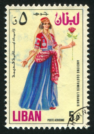 LEBANON CIRCA 1973: stamp printed by Lebanon, shows Woman with Rose, circa 1973の写真素材