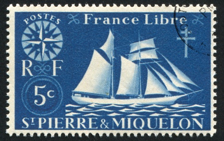 ST. PIERRE AND MIQUELON - CIRCA 1942: stamp printed by Saint Pierre and Miquelon, shows St. Malo Fishing Schooner, circa 1942.の写真素材