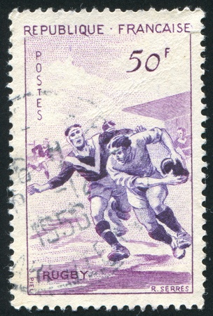 FRANCE - CIRCA 1956: stamp printed by France, shows Rugby, circa 1956の写真素材