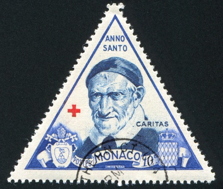 MONACO - CIRCA 1951: stamp printed by Monaco, shows St. Vincent de Paul, circa 1951のeditorial素材