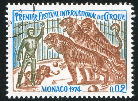 MONACO - CIRCA 1974: stamp printed by Monaco, shows Trainer and Tigers, circa 1974の写真素材