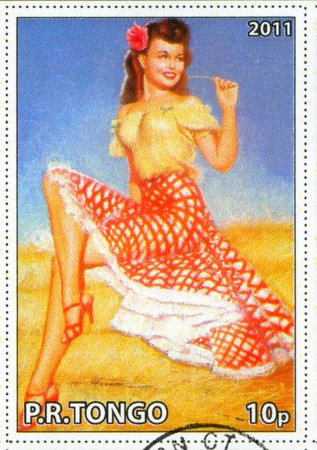 TONGO - CIRCA 2011: stamp printed by Tongo, shows Pin-up girl, by Earl MacPherson, circa 2011のeditorial素材