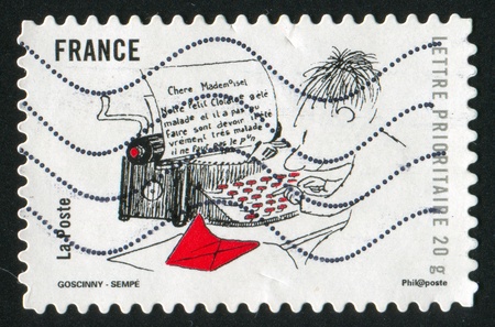 FRANCE - CIRCA 2009: stamp printed by France, shows Le petit Nicolas Self, circa 2009のeditorial素材