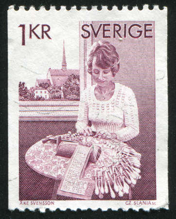 SWEDEN - CIRCA 1976: stamp printed by Sweden, shows Bobbin Lace Maker, circa 1976のeditorial素材