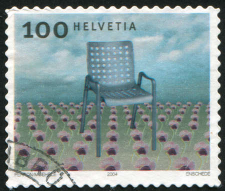SWITZERLAND - CIRCA 2004: stamp printed by Switzerland, shows Aluminum chair, by Hans Coray, circa 2004の写真素材