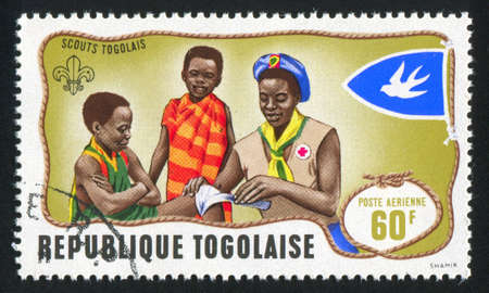 TOGO - CIRCA 1968: stamp printed by Togo, shows First aid practice, circa 1968のeditorial素材