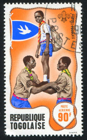 TOGO - CIRCA 1968: stamp printed by Togo, shows Scout game, circa 1968のeditorial素材