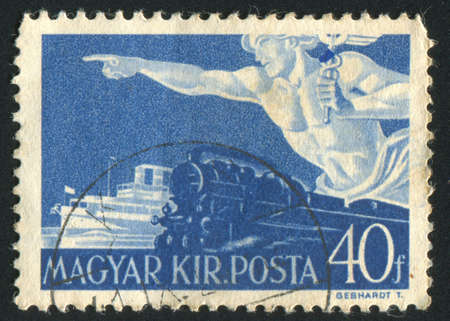 HUNGARY - CIRCA 1941: stamp printed by Hungary, shows Mercury, train and boat, circa 1941のeditorial素材
