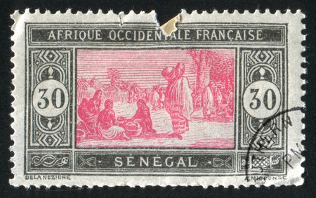 SENEGAL - CIRCA 1914: stamp printed by Senegal, shows Senegalese Preparing Food, circa 1914の写真素材