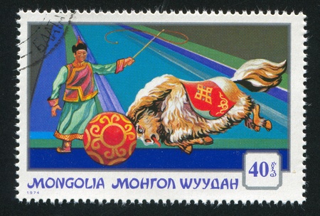 MONGOLIA - CIRCA 1974: stamp printed by Mongolia, shows yak pushing ball, circa 1974の写真素材