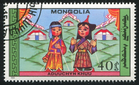 MONGOLIA - CIRCA 1988: stamp printed by Mongolia, shows  Puppets, circa 1988の写真素材