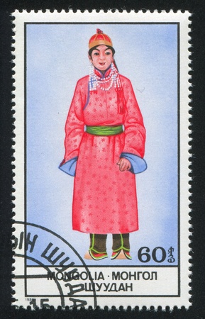 MONGOLIA - CIRCA 1986: stamp printed by Mongolia, shows Woman in National Costume, circa 1986のeditorial素材