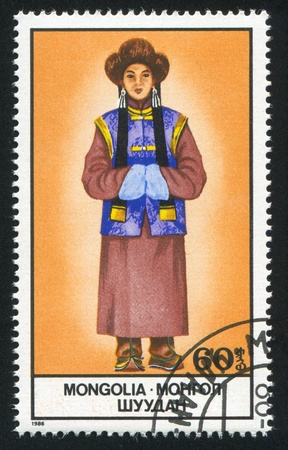 MONGOLIA - CIRCA 1986: stamp printed by Mongolia, shows Woman in National Costume, circa 1986のeditorial素材
