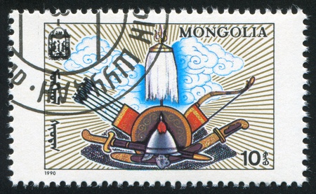 MONGOLIA - CIRCA 1990: stamp printed by Mongolia, shows armour and cold weapon, circa 1990の写真素材