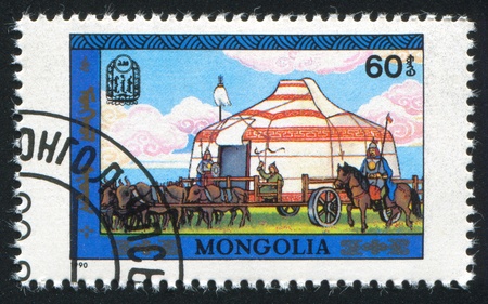 MONGOLIA - CIRCA 1990: stamp printed by Mongolia, tent with horses, circa 1990の写真素材