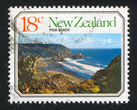 NEW ZEALAND - CIRCA 1977: stamp printed by New Zealand, shows Ocean Beach, Piha Beach, circa 1977の写真素材