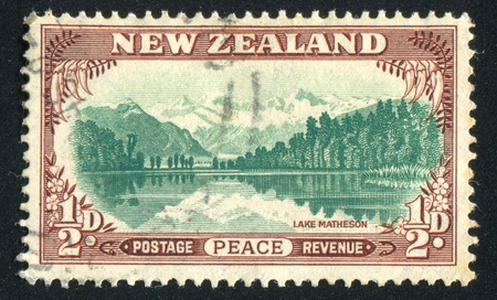 NEW ZEALAND - CIRCA 1946: stamp printed by New Zealand, shows Lake Matheson, circa 1946のeditorial素材