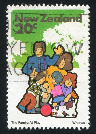 NEW ZEALAND - CIRCA 1981: stamp printed by New Zealand, shows family and dog, circa 1981のeditorial素材