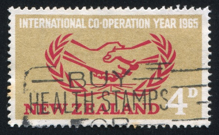 NEW ZEALAND - CIRCA 1965: stamp printed by New Zealand, shows the Emblem of International...