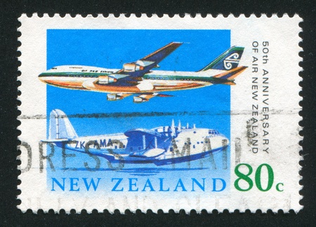 NEW ZEALAND - CIRCA 1990: stamp printed by New Zealand, shows Short S30 Empire Class Flying Boat, Boeing 747-200, circa 1990のeditorial素材
