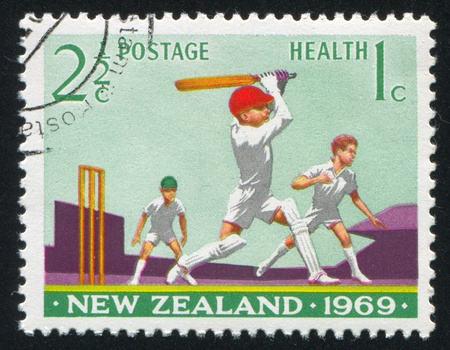 NEW ZEALAND - CIRCA 1969: stamp printed by New Zealand, shows Boys Playing Cricket, circa 1969のeditorial素材