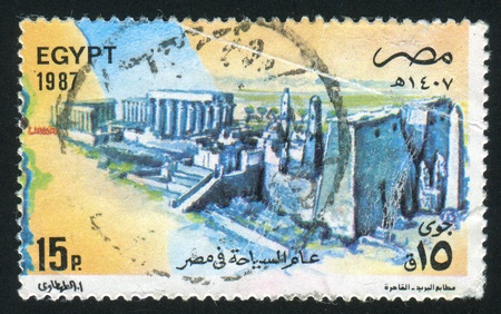 EGYPT - CIRCA 1987: stamp printed by Egypt, shows Temple of Theban Triad, Luxor, circa 1987のeditorial素材