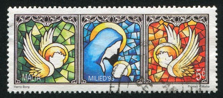 MALTA - CIRCA 1996: stamp printed by Malta, shows Madonna and Child, circa 1996のeditorial素材