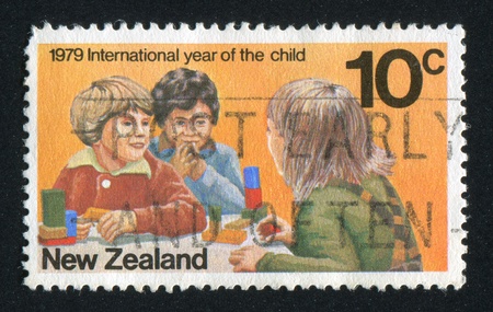 NEW ZEALAND - CIRCA 1979: stamp printed by New Zealand, shows Children Playing, circa 1979のeditorial素材