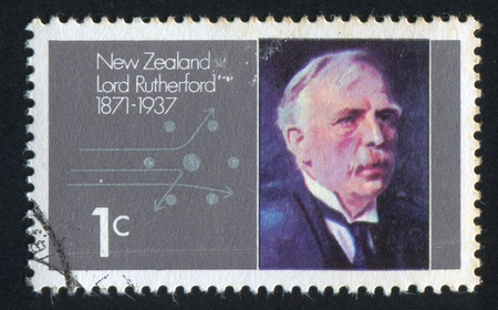 NEW ZEALAND - CIRCA 1971: stamp printed by New Zealand, shows Lord Rutherford and Alpha Particles Passing Atomic Nucleus, circa 1971のeditorial素材