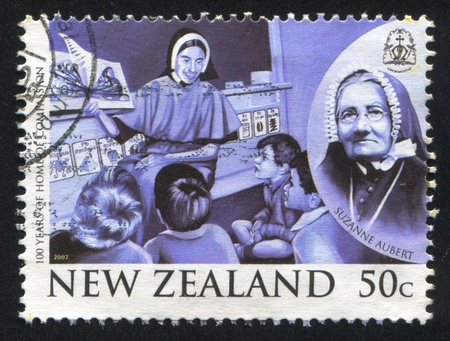 NEW ZEALAND - CIRCA 2007: stamp printed by New Zealand, shows Sister of Compassion Teaching Children, Suzanne Aubert, Founder of Sisters of Compassion, circa 2007のeditorial素材