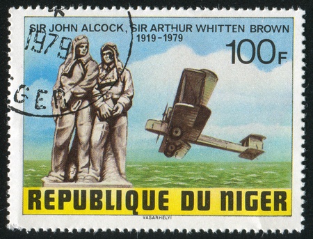 NIGER - CIRCA 1979: stamp printed by Niger shows John Alcock, Arthur Whitten Brown, Vickers-Vimy Biplane, circa 1979のeditorial素材