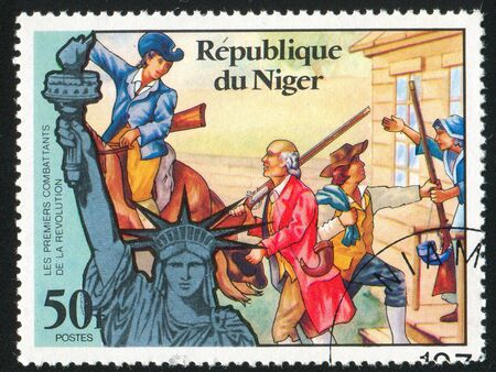 NIGER - CIRCA 1976: stamp printed by Niger shows Statue of Liberty and call to arms, circa 1976のeditorial素材