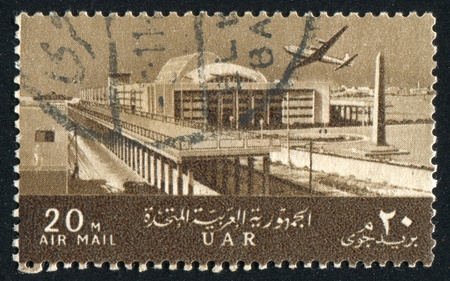 EGYPT - CIRCA 1963: stamp printed by Egypt, shows Plane, Maritime Station, Alexandria, circa 1963の写真素材