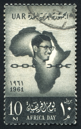 EGYPT - CIRCA 1961: stamp printed by Egypt, shows Patrice Lumumba and map, circa 1961のeditorial素材