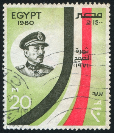 EGYPT - CIRCA 1980: stamp printed by Egypt, shows Portrait and stylized Egypt flag, circa 1980のeditorial素材