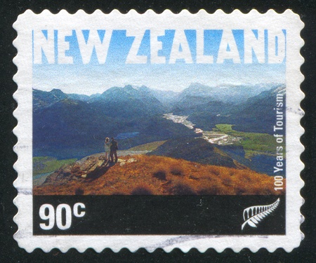 NEW ZEALAND - CIRCA 2001: stamp printed by New Zealand, shows Sightseers on Mountain Alfred, circa 2001の写真素材